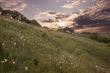 Dramatic sunset over hilly countryside