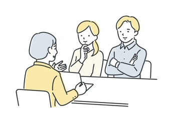 担当者の説明を聞く若い夫婦・カップル