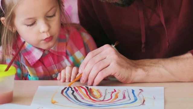 Painting education. Parent learning. Father man teaching daughter little girl in fairy princess costume colors develop creative skills at table.