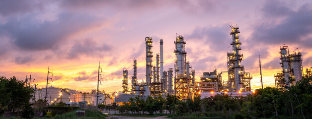 Oil Refinery Plant at sunset. Gas Chemical Equipment Prodiction import export Concept, Crude Oil Refinery Plant Steel Pump Pipe line and Chimney and Cooling tower, Chemical or Petrochemical plant