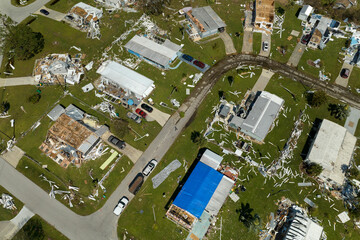 Aerial view of natural disaster consequences in Florida Southwest region. Severely damaged by hurricane Ian mobile homes in residential area