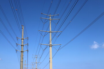 Power electric pole with line wires on insulators.