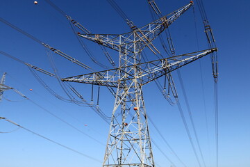 Power electric pole with line wires on insulators.