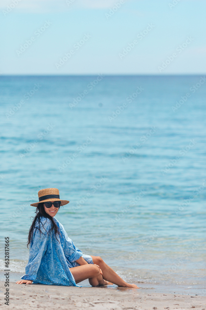 Wall mural Young beautiful woman on beach vacation on Caribs