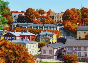  Finnish town Porvoo in Finland with autumn colors. Yellow and red trees and nice wooden buildings. Good tourism town Porvoo with colorful autumn theme. Color composition.  © VFX Photographer
