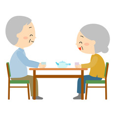 Fototapeta premium 食卓で楽しく会話しながらお茶を飲んでいる老夫婦