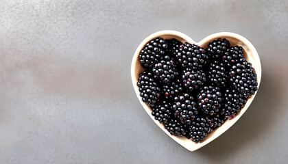 Blackberries in bowl in the shape of a heart, a top view