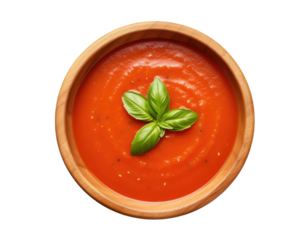 Tomato soup in wooden bowl isolated on white background, top view