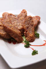deep fried crispy wu xiang pork meat roll with spicy sauces in plate on white background fusion asian halal food appetiser snack menu for restaurant banquet