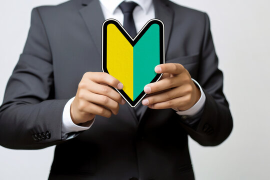 Businessman's hand with a Japanese beginner's mark