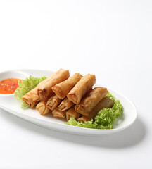 deep fried crispy vegetable spring roll with thai chilli spicy sauce salad in plate on white background design appetiser food dim sum snack halal menu for Hong Kong cafe