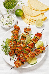 chicken souvlaki with thyme and lime on plate