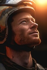 Obraz premium a man in a helmet looks at the sun