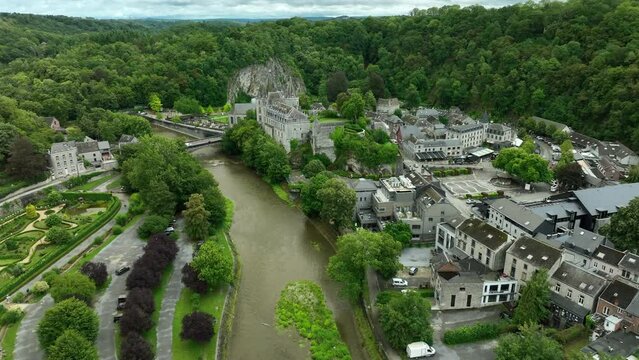 Drone arc shot over Ourthe River of Château de Durbuy in city of Durby, Belgium