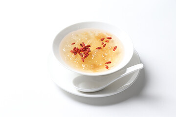 chilled double boiled fresh bird nest with hashima and wolf berries asian sweet soya milk soup in white bowl healthy dessert halal vegan food menu for Hong Kong cafe
