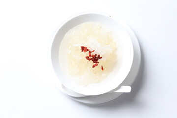 chilled double boiled fresh bird nest with hashima and wolf berries asian sweet soya milk soup in white bowl healthy dessert halal vegan food menu for Hong Kong cafe