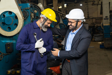 Businessman or engineer shake hand with senior worker or technician