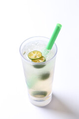 ice cold chilled fresh sour lime fruit honey drink in glass and green straw beverage halal food vegan menu in white background for cafe