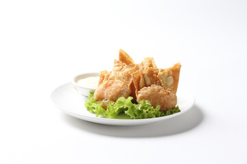 deep fried crispy meat dumpling wanton har gao in vegetable salad plate appetiser breakfast dim sum Halal food menu serve with tartar salad sauce for Hong Kong cafe