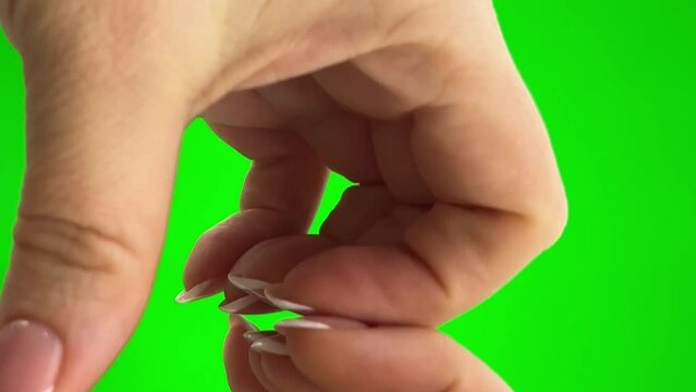 different emotions with female hands on green background chroma key stop war female hands close screen repulsion of trouble after that the woman makes 