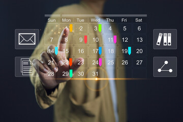 Reminder appointment calendar for organizer agenda time table and event planner organize and schedule activity. Man pointing on calendar or schedule to marking color paper note target date appointing.