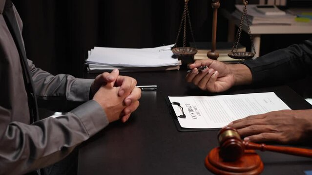 Attorneys or lawyers who are reading the statute of limitations Consultation between male lawyers and business clients, tax and legal and legal services firms.