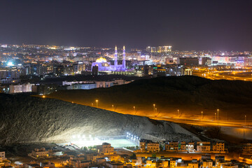 Fototapeta na wymiar Night view of Muscat city and Muhammed Al Ameen Mosque. Sultanate of Oman