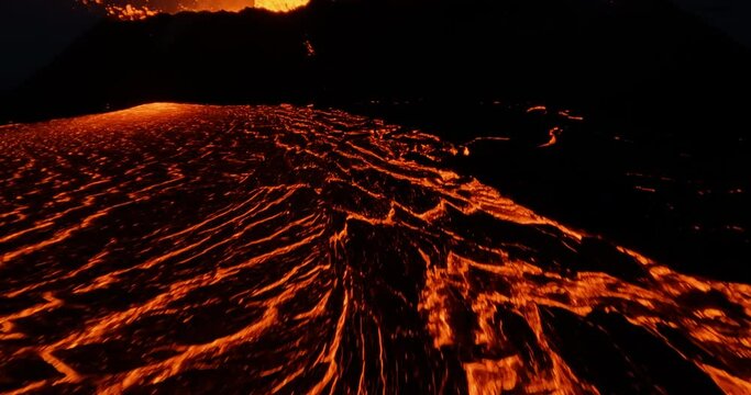 Epic FPV drone shot really close to glowing lava at a erupting volcano basin