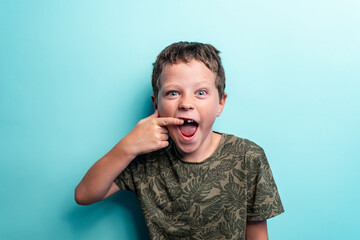 The kid lost a tooth. Baby without a tooth. Portrait of a little boy no tooth.