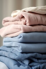Stack of clothes on the table. Shallow depth of field.