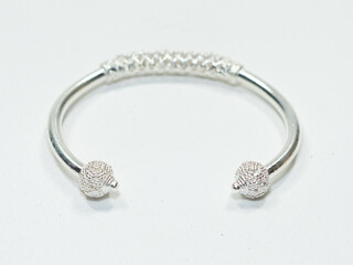 Silver jewelry and gemstone on white background