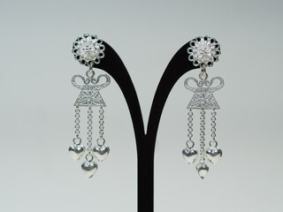 Silver jewelry and gemstone on white background