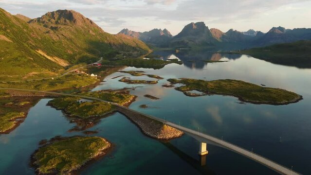 View of Fredvang Bridge in the Lofoten islands, Norway, under the midnight sun.