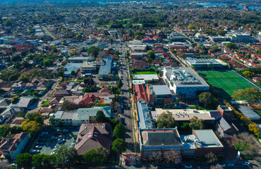 Panoramic Aerial Drone view of Suburban Sydney housing, roof tops, the streets and the parks NSW Australia