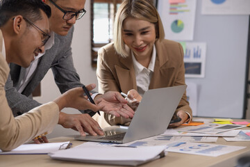 Group of business team working with analysis financial data visualization tech for marketing strategy, Businesswoman accountant or financial report graph at desk in corporate office. 