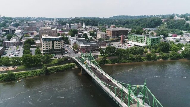 Aerial view of Easton PA and Delaware River approaching city over the bridge