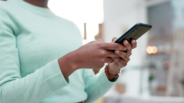 Woman, hands and typing on smartphone in home, reading social media notification or subscription online. Closeup of female person on cellphone to download mobile games, search digital network and app