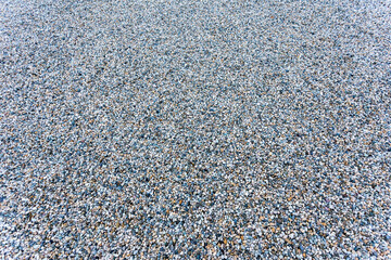 Background texture of fine grained grey gravel