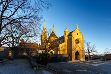 View of an old stone church at sunset