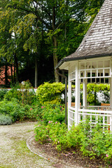 Little white wooden garden gazebo