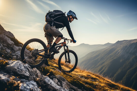 Young man riding bicycle on mountain trail sport