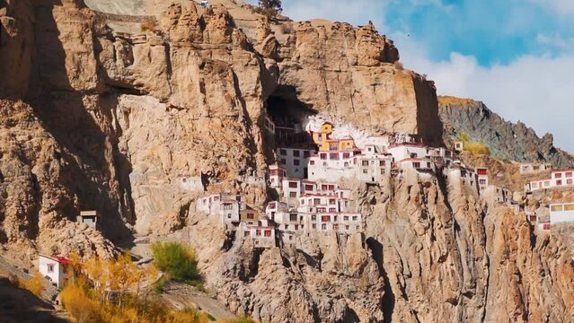 View of the Phugtal monastery built inside the mountain cave during the sunset near Purne in Zanskar Valley, Ladakh, India. Monastery built inside mountains in Zanskar. Remote monastery in India.	