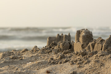 Sand castle on the beach during a summer day - 632892651