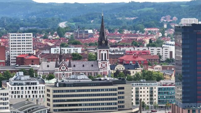 Sofiakyrkan christian church in Jonkoping. Reveal of scenic cityscape city in Sweden. Aerial panoramic,
