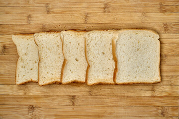 Organic toast bread on a wooden surface