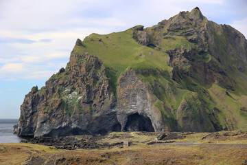 Rock formation with cave at Halldorsskora or Elephant Rock on the Coast of Heimaey Island- Vestmannaeyjar-Westman Islands-Iceland