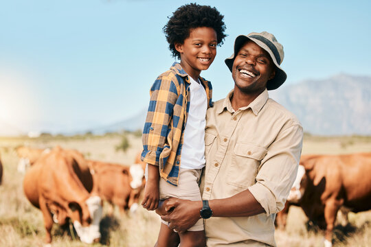 Happy black man, portrait and child with animals on farm for agriculture, sustainability or live stock cattle. African male person, dad and boy kid smile for natural farming or produce in countryside