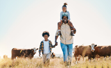Family, father and children with animals on a farm outdoor for cattle, travel and holiday. Portrait...
