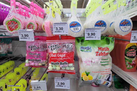 PENANG, MALAYSIA - 11 JULY 2023: Various choices of mothballs display on shelf in Giant hypermarket. Mothballs are small balls of chemical pesticide and deodorant to damage from mold or moth larvae.