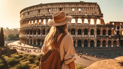 Foto op Plexiglas Oud gebouw Rear view Young girl with backpack are looking at the Colosseum in Rome, Exciting journey through Italy.